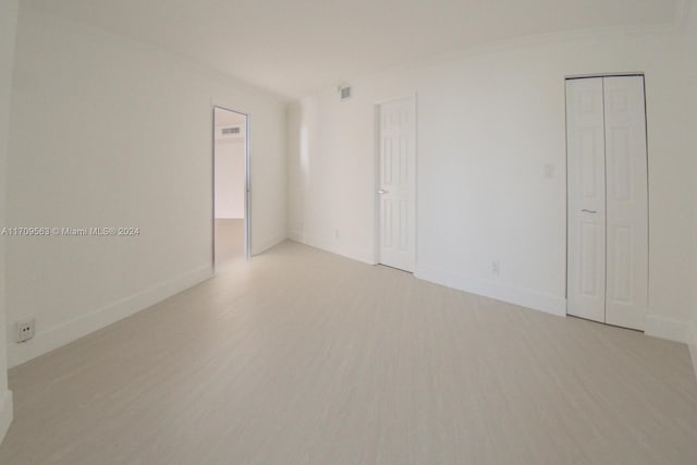 unfurnished room with light hardwood / wood-style floors