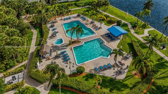 birds eye view of property with a water view