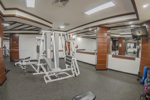 exercise room with ornamental molding