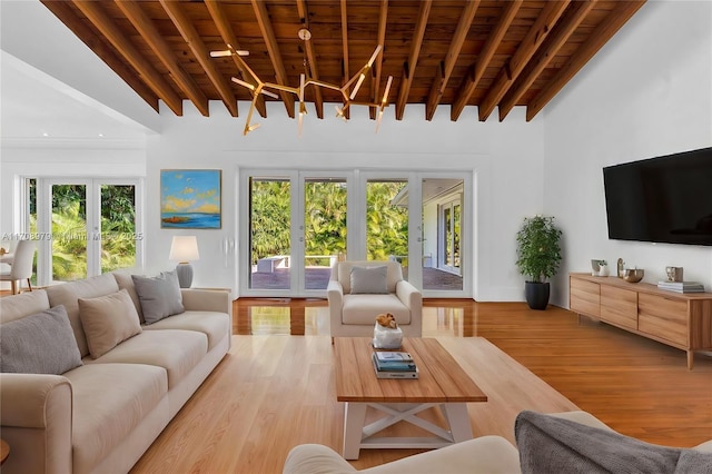 1431 Ancona Ave, Coral Gables, FL 33146 - living room featuring wooden ceiling with exposed beams, plenty of natural light, and light wood finished floors