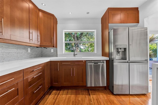 1431 Ancona Ave, Coral Gables, FL 33146 - kitchen with appliances with stainless steel finishes, plenty of natural light, a sink, tasteful backsplash, and recessed lighting