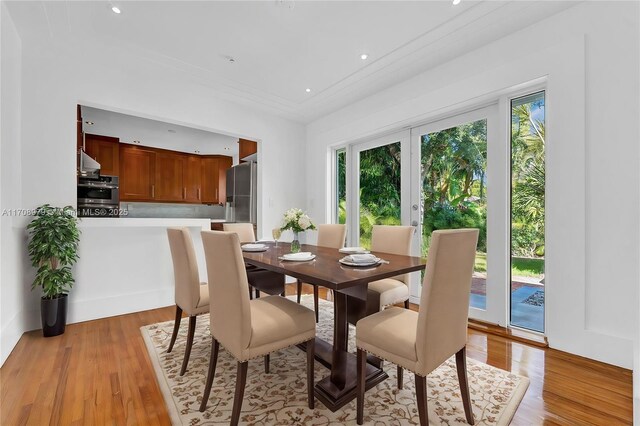 1431 Ancona Ave, Coral Gables, FL 33146 - dining area with light wood finished floors, recessed lighting, and ornamental molding
