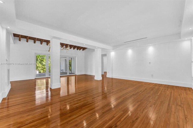 1431 Ancona Ave, Coral Gables, FL 33146 - spare room with wood-type flooring, baseboards, beamed ceiling, and recessed lighting