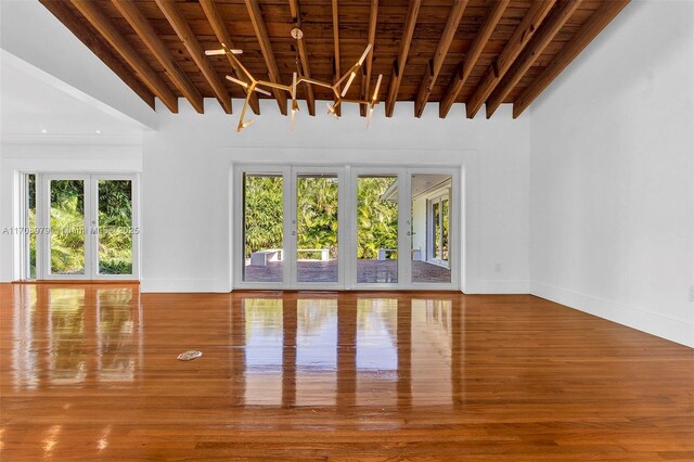 1431 Ancona Ave, Coral Gables, FL 33146 - unfurnished living room with wood ceiling with exposed beams and wood finished floors