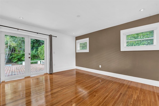 1431 Ancona Ave, Coral Gables, FL 33146 - empty room with baseboards, wood finished floors, french doors, and recessed lighting