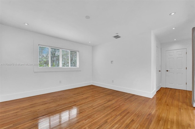 1431 Ancona Ave, Coral Gables, FL 33146 - empty room with light wood-style flooring, baseboards, and recessed lighting