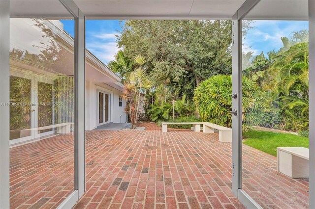 1431 Ancona Ave, Coral Gables, FL 33146 - view of patio featuring french doors