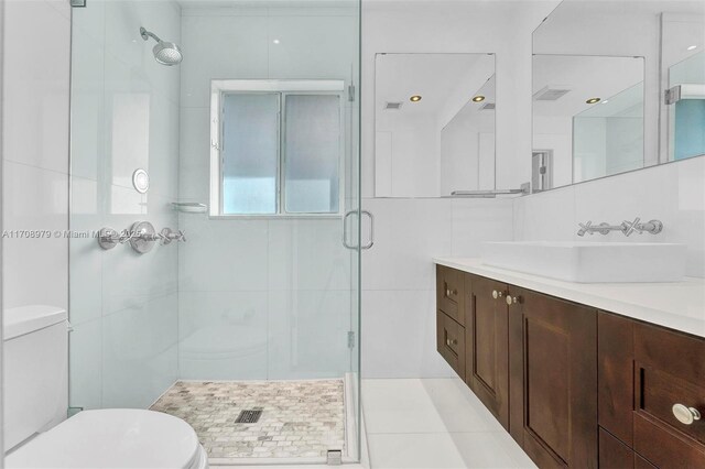 1431 Ancona Ave, Coral Gables, FL 33146 - full bathroom featuring toilet, vanity, a stall shower, and tile patterned floors