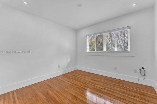 1431 Ancona Ave, Coral Gables, FL 33146 - unfurnished room featuring baseboards, light wood-style floors, and recessed lighting