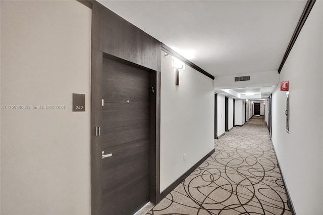 hallway with crown molding