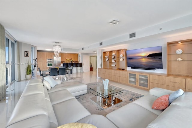 living room featuring a chandelier