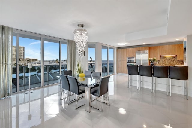 tiled dining room with expansive windows