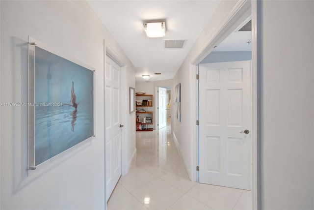 hallway featuring light tile patterned floors