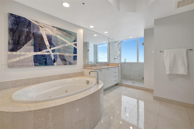 bathroom featuring vanity, tile patterned floors, and independent shower and bath