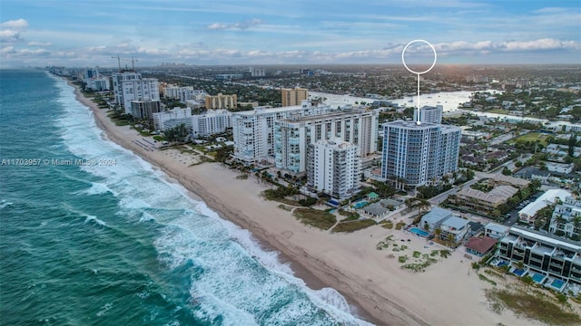 aerial view with a view of the beach and a water view