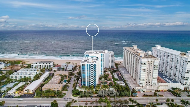 aerial view featuring a water view and a view of the beach