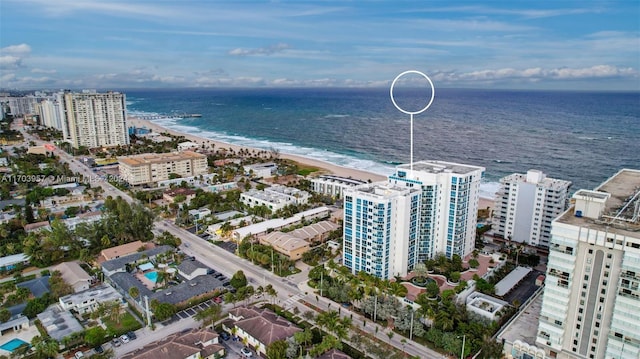 bird's eye view with a beach view and a water view