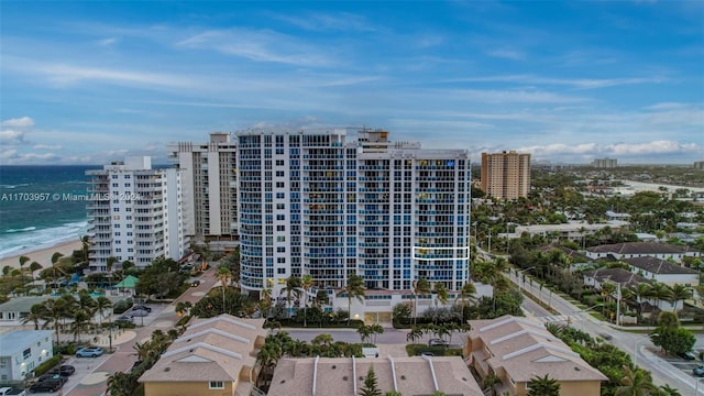 view of property featuring a view of the beach and a water view