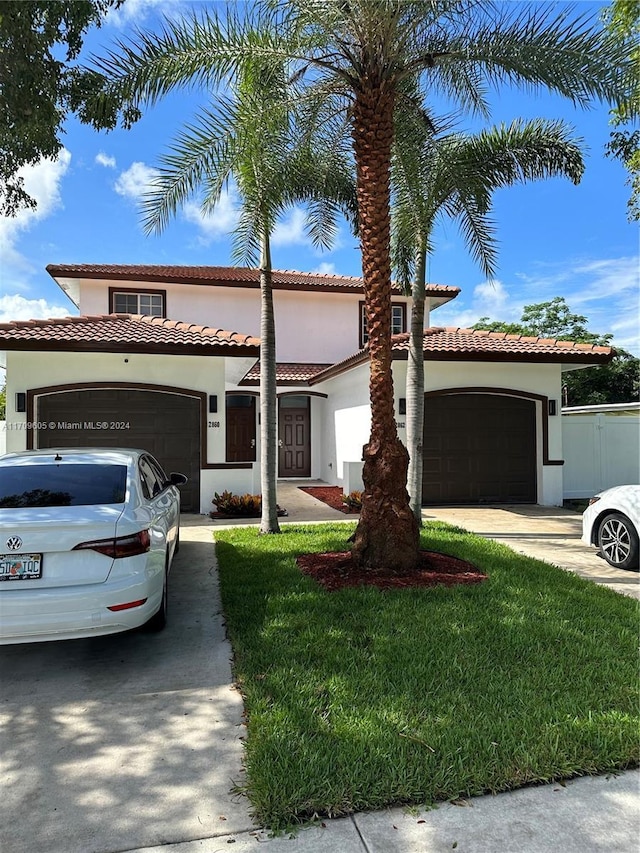 mediterranean / spanish-style home featuring a front lawn