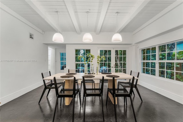 dining room with french doors, beamed ceiling, and a healthy amount of sunlight