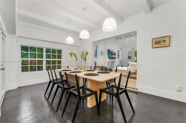 dining space featuring beamed ceiling and wood ceiling