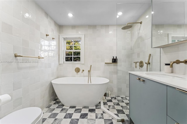 full bathroom with toilet, vanity, separate shower and tub, and tile walls