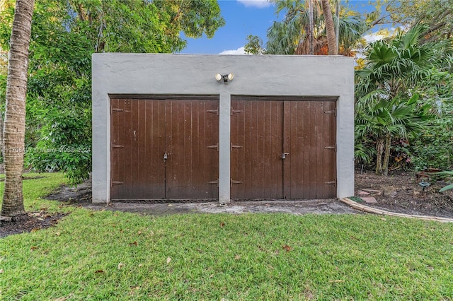 view of outbuilding with a lawn