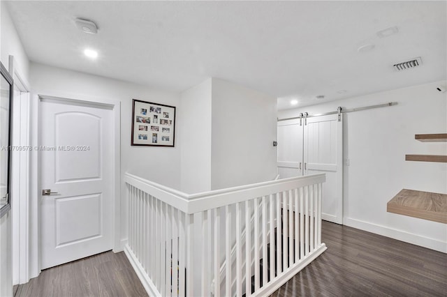10307 SW 20th St, Miramar, FL 33025 - hall with wood finished floors, a barn door, an upstairs landing, and recessed lighting
