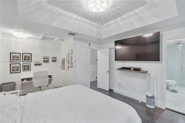 10307 SW 20th St, Miramar, FL 33025 - bedroom featuring wood finished floors, ensuite bath, and attic access