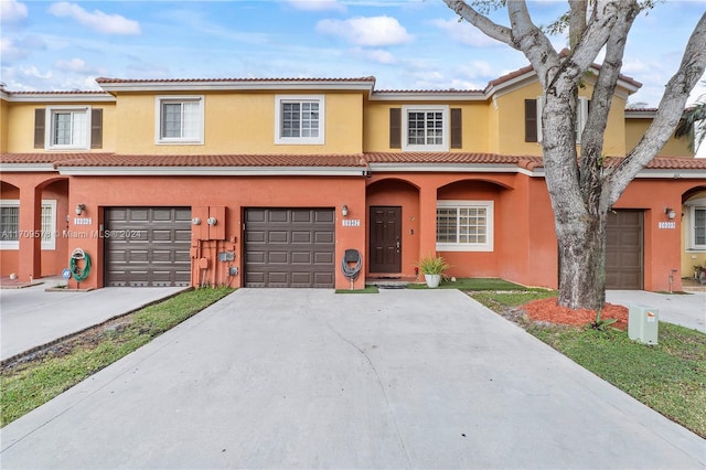 10307 SW 20th St, Miramar, FL 33025 - view of property with driveway, stucco siding, a tiled roof, and a garage