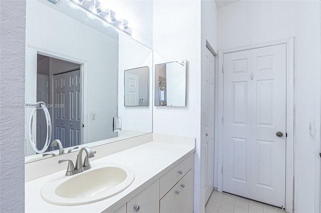 bathroom with vanity and tile patterned flooring