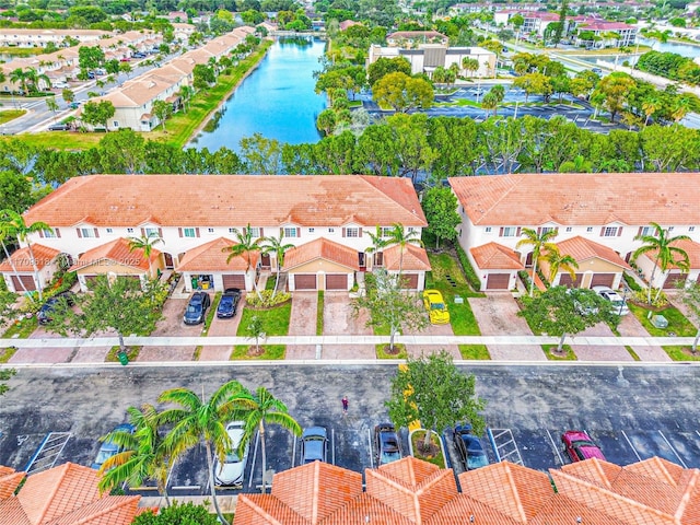 aerial view with a residential view and a water view