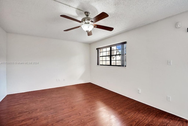 unfurnished room with hardwood / wood-style floors, ceiling fan, and a textured ceiling