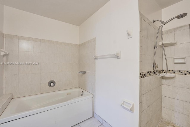 bathroom featuring tile patterned floors and tiled shower / bath combo