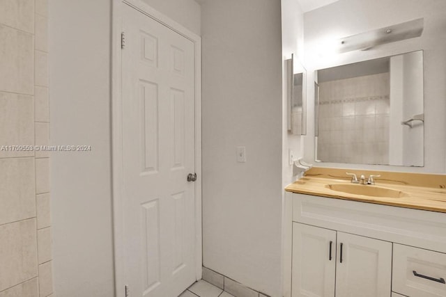 bathroom with tile patterned flooring and vanity