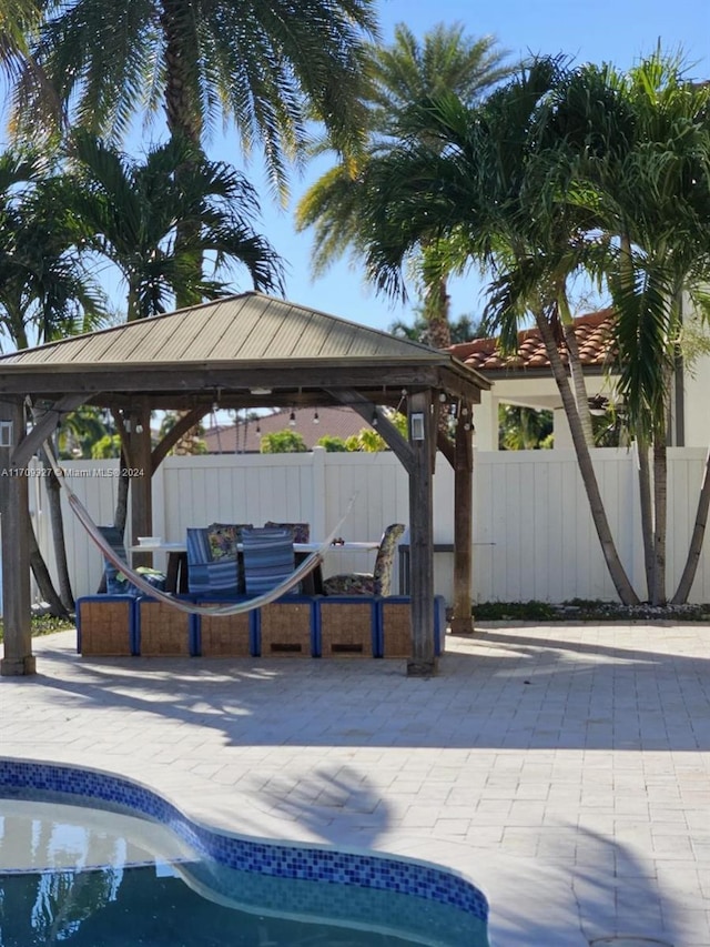 view of pool featuring a gazebo and a patio