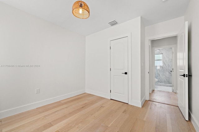 unfurnished bedroom featuring light wood-type flooring