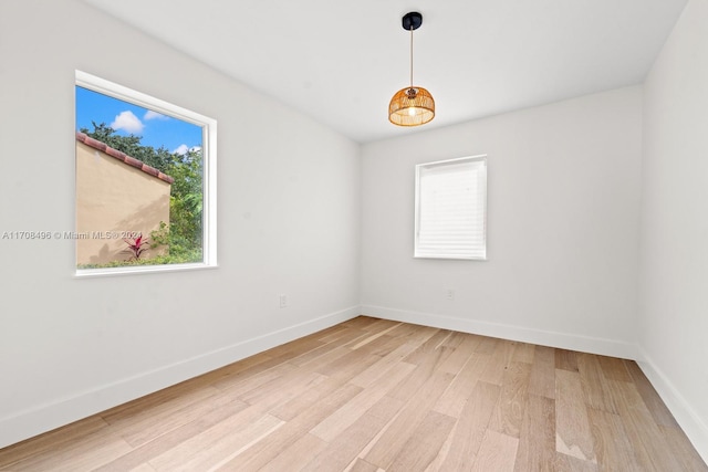 spare room featuring hardwood / wood-style floors