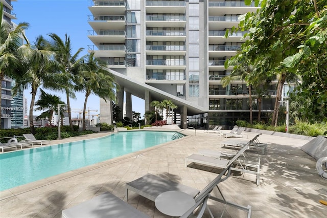 view of swimming pool with a patio