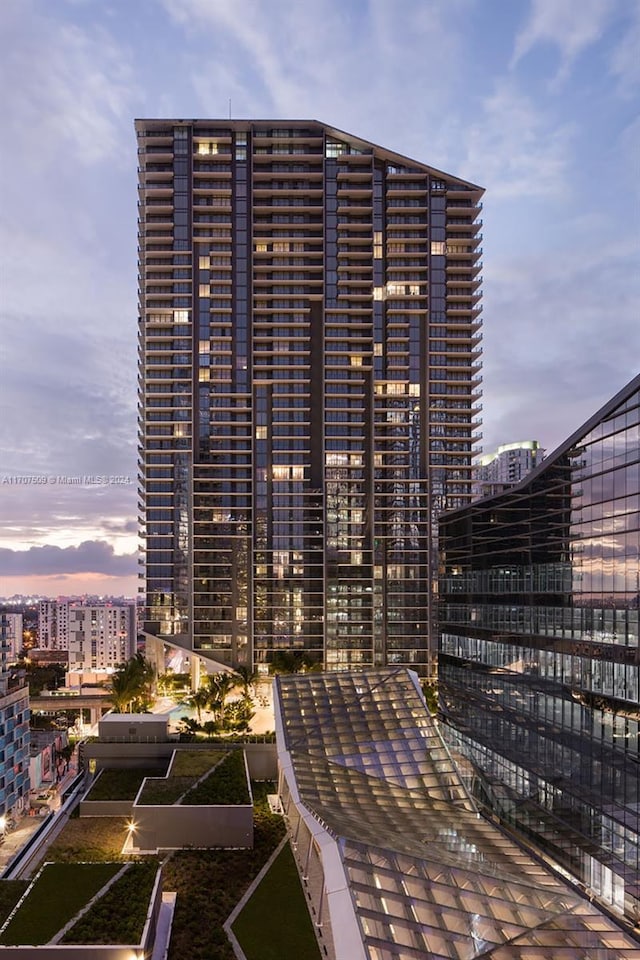 view of outdoor building at dusk