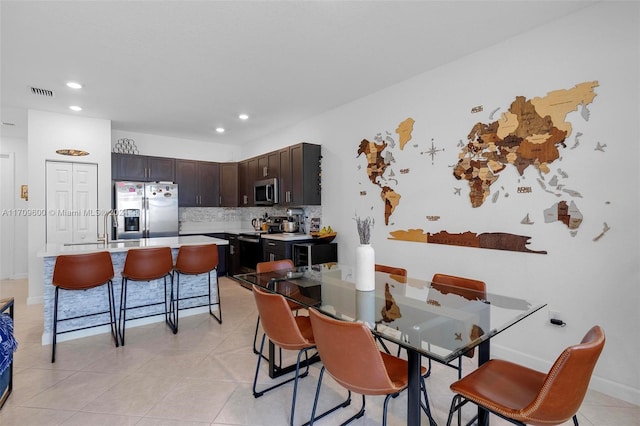 tiled dining area with sink