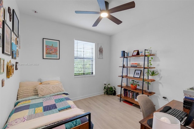 bedroom featuring ceiling fan and light hardwood / wood-style flooring