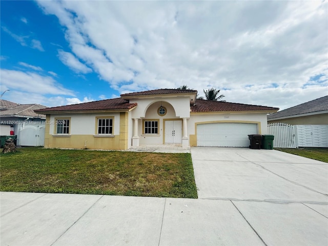 view of front facade featuring a front yard and a garage