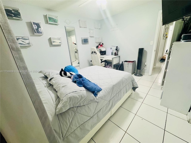 bedroom with light tile patterned floors and ceiling fan