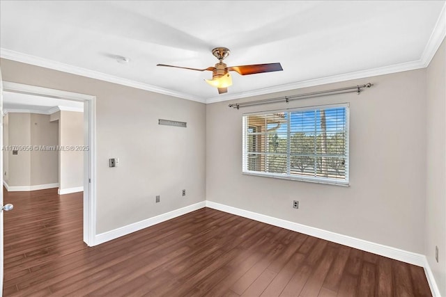 spare room featuring crown molding, dark hardwood / wood-style floors, and ceiling fan