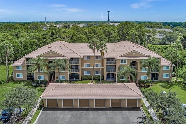 3659 NW Adriatic Ln Unit 305, Jensen Beach, FL 34957 - view of property with community garages