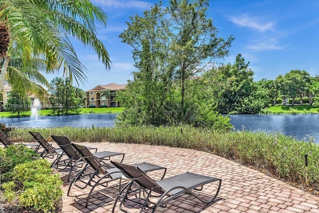 view of patio featuring a water view