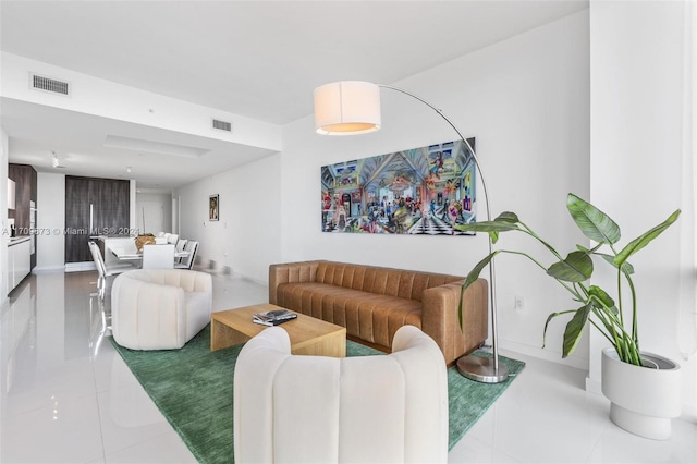 living room with light tile patterned flooring