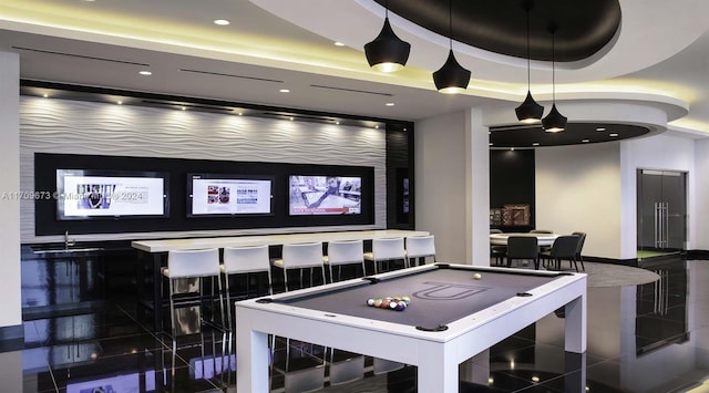 playroom featuring dark tile patterned flooring, a raised ceiling, sink, and billiards