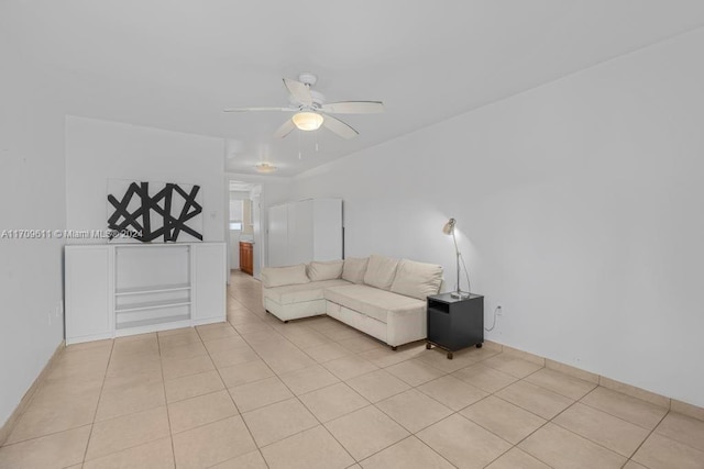 unfurnished living room with ceiling fan and light tile patterned floors